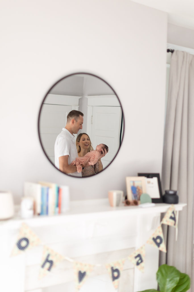 mom and dad mirror reflection newborn photography
